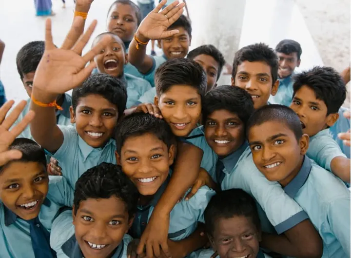Group of children waving