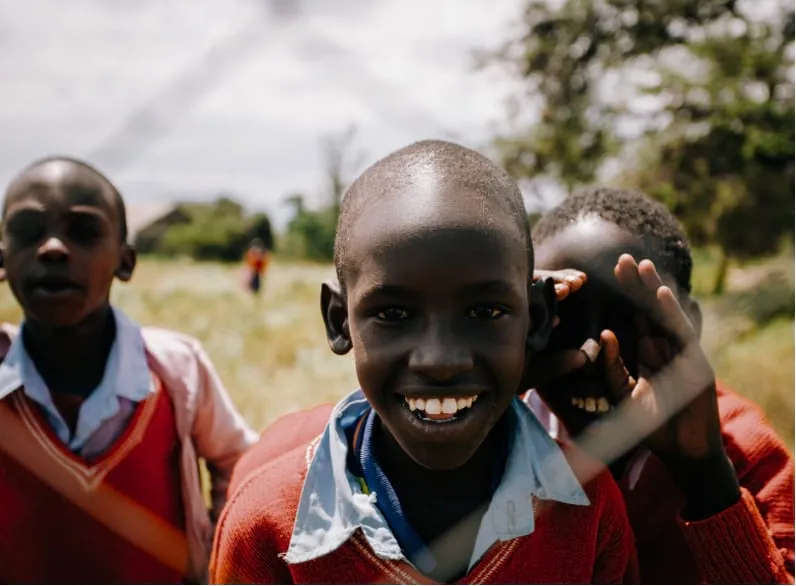 Smiling children at a partner school