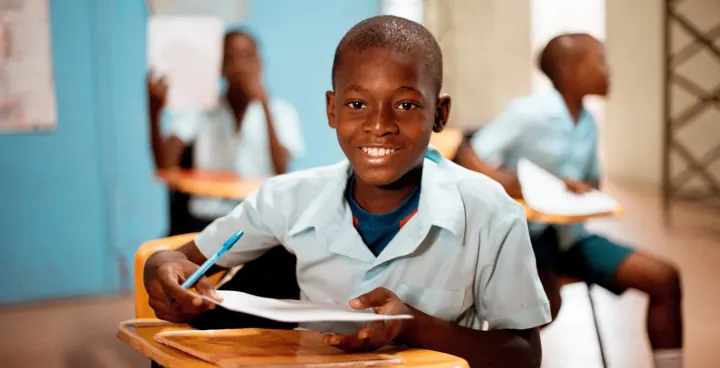 Child writing during a lesson